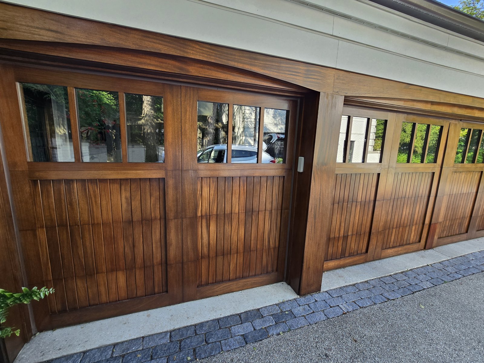 Refinished wood-panel garage doors, Des Plaines IL
